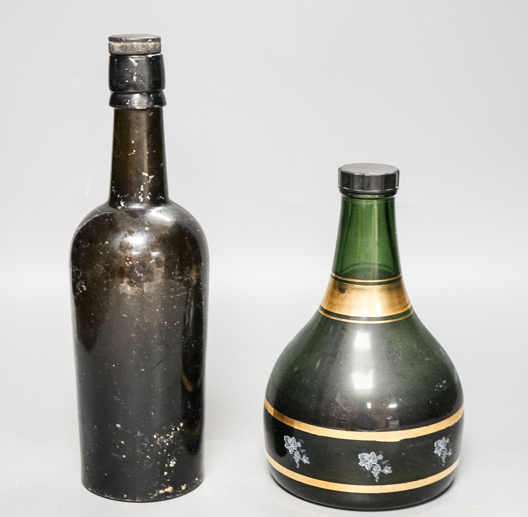An old Fremlin of Maidstone beer bottle and an old Gregory Scotch whisky musical bottle